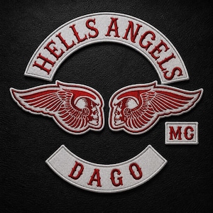 May include: An embroidered patch set featuring a white arched top rocker with red text reading HELLS ANGELS, a central winged skull emblem in red and white, a small rectangular MC patch, and a white bottom rocker with red text reading DAGO.