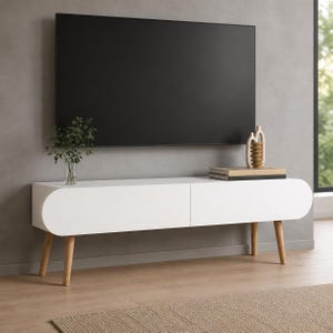 May include: A white media console with rounded ends and four light wood tapered legs. The console features two cabinet doors and sits below a large flat-screen television. A glass vase with green foliage and a decorative object sit on top.