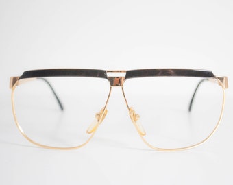 Marcolin Italian Vintage Eyeglasses. Gold Tone and Glossy Black Front.