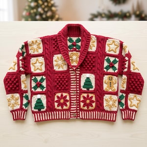 May include: A red crochet cardigan featuring a shawl collar and a button-front closure. The garment is constructed from square panels displaying various holiday-themed motifs, including stars, holly, Christmas trees, and a gingerbread person.