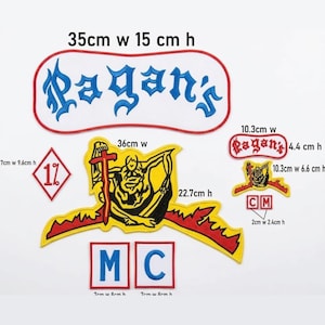 May include: A collection of embroidered patches including a large white patch with blue text reading Pagan's, a yellow and black graphic patch, a red and white 1% diamond patch, and two square patches with blue letters M and C, with dimensions listed in cm.