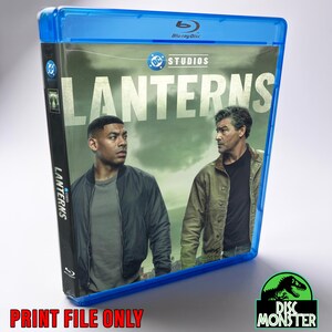 May include: A blue Blu-ray case for the DC Studios production titled LANTERNS. The cover art features two men standing against a cloudy sky background. The title LANTERNS is printed in large white capital letters across the top centre of the case.
