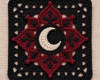 May include: A square crochet motif featuring a black border with a lattice pattern. The center displays a dark red floral design with black accents and a cream-colored crescent moon shape stitched in the middle of a circular black background.