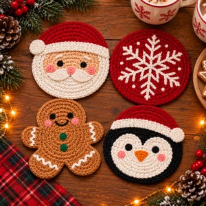 May include: A set of four round and shaped crochet coasters featuring holiday designs: a Santa Claus face, a white snowflake on a red background, a brown gingerbread person, and a penguin face wearing a red Santa hat with white trim.
