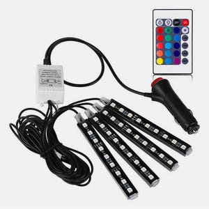 May include: A set of four black LED light strips with a white control box, a black power cable with a cigarette lighter plug, and a rectangular remote control featuring various color buttons, power controls, and lighting mode settings.