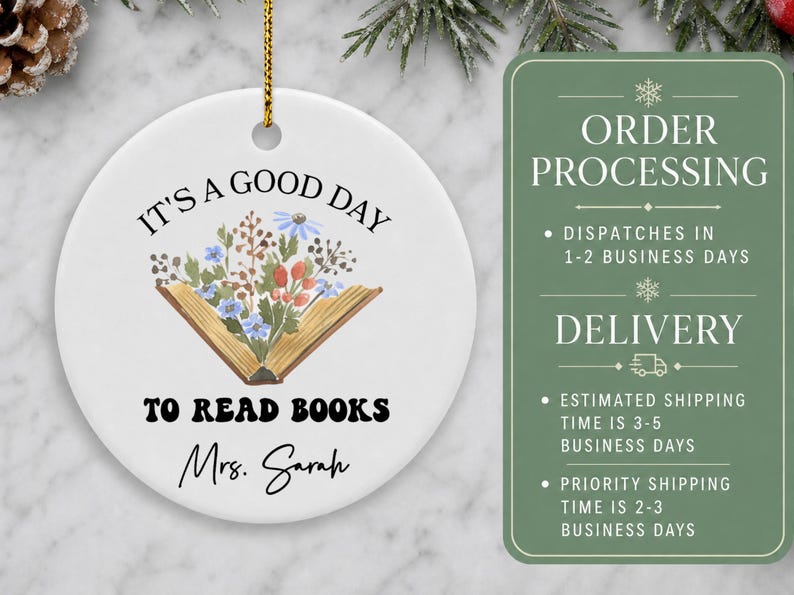 Ceramic ornament with "It's a good day to read books Mrs. Sarah" and floral book design.