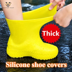 May include: A bright yellow, flexible silicone shoe cover with a textured tread pattern on the sole. The cover is being pulled over a foot. A red starburst graphic contains the text Thick, and the text Silicone shoe covers is below.