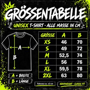 May include: A black size chart for a unisex t-shirt with neon green text and graphics. The chart displays measurements in centimeters for sizes XS to 2XL, labeled A for width and B for length, with a tolerance of approximately 2 cm indicated.
