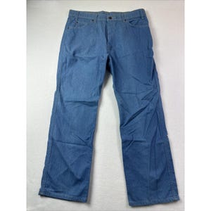May include: A pair of medium blue denim jeans featuring a classic five-pocket design, a button and zipper fly closure, belt loops at the waistband, and straight-cut legs with visible stitching along the seams and pockets throughout the garment.