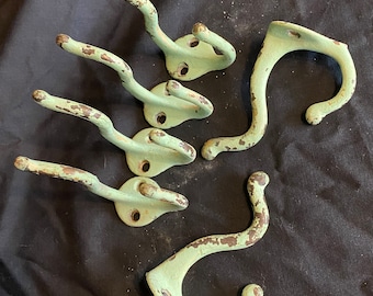 Antique coat hooks in mint green