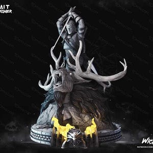 May include: A gray-toned resin statue of a warrior figure holding a sword above their head, standing atop a large, snarling creature with prominent antlers. The base features yellow flame accents and a wolf medallion, with text reading GERALT THE WITCHER.