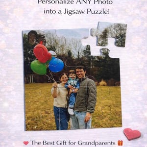 May include: A personalized jigsaw puzzle featuring a family portrait with balloons. The text reads "The Gift They'll Keep Forever" and "Personalize ANY Photo into a Jigsaw Puzzle!" with a "Shop Now" button.
