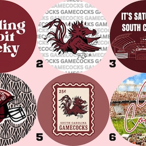 May include: Six circular buttons featuring South Carolina Gamecocks themes. Designs include the text 'feeling a bit cocky', a rooster mascot, a stadium graphic with 'IT'S SATURDAY IN SOUTH CAROLINA', a football helmet, a postage stamp graphic, and a stadium photo.