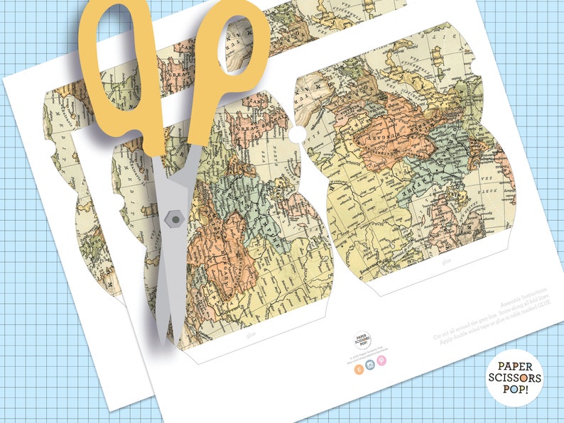 May include: Printable DIY paper craft project featuring a vintage world map design. The template includes a cut-out shape for a box, with instructions to "Cut all around the lines. Score along all fold lines. Apply double sided tape to the tabs and assemble the box."