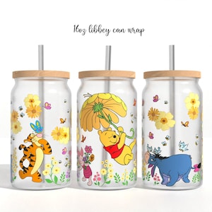 May include: Three 473ml Libbey glass can tumblers with bamboo lids and straws. The glasses feature colourful illustrations of Winnie the Pooh, Tigger, Piglet, and Eeyore surrounded by yellow flowers, green stems, small bees, and butterflies.