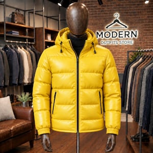 May include: A bright yellow puffer jacket with a hood, a black front zipper, and two black zippered side pockets. The jacket features horizontal quilted stitching, ribbed cuffs, and a black high-neck collar underneath, displayed on a mannequin.