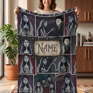 May include: A rectangular fleece blanket featuring a multi-panel comic book style layout with illustrations of a pale bride and a groom character. The center panel contains a decorative frame with the word NAME printed in a gothic font.