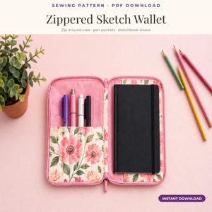 May include: A zippered sketch wallet featuring a pink floral fabric interior with pen pockets and a sleeve for a black sketchbook. The text reads: SEWING PATTERN · PDF DOWNLOAD, Zippered Sketch Wallet, Zip-around case · pen pockets · sketchbook sleeve, INSTANT DOWNLOAD.