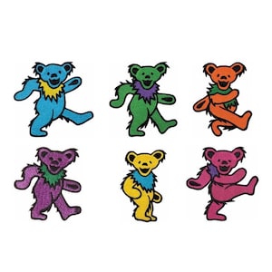May include: Six colorful embroidered patches featuring a dancing bear with a flower on its head. The bears are blue, green, orange, purple, yellow, and pink.