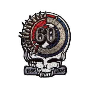 May include: Embroidered patch featuring a skull design with a circular emblem. The emblem includes the number "60" in the center, surrounded by red, gray, and blue accents. The patch also includes the years "1965" and "2025".
