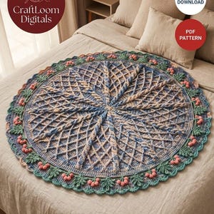 May include: A circular crochet blanket featuring a central cable pattern in shades of blue and beige. The border is decorated with green crocheted leaves and small pink berry clusters. Text on the image reads CraftLoom Digitals, Digital Download, PDF Pattern.