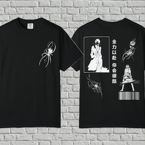 May include: A black t-shirt featuring a white spider graphic on the front. The back displays a white anime-style character in a coat, a rose, another spider, a barcode, and Chinese text that reads 全力以赴 你会很酷, arranged in a vertical layout.