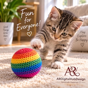 May include: A small, round, crocheted ball featuring horizontal stripes in red, orange, yellow, green, blue, and purple. A tabby kitten reaches toward the ball with one paw. The text "Fun for Everyone!" and "ARDigitalHubDesign" are visible.