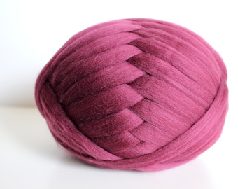 May include: A large ball of deep burgundy chunky yarn, ideal for knitting or crocheting.