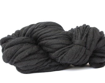 May include: A large ball of black yarn, perfect for knitting or crocheting.