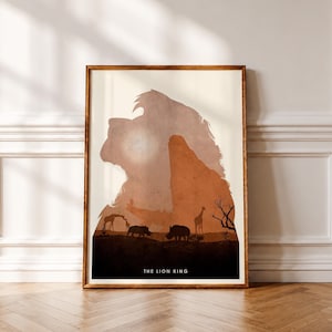 May include: A framed vertical art print featuring a large silhouette of a lion's head in shades of beige and orange. Inside the silhouette are smaller black silhouettes of giraffes, rhinos, and a tree. The text THE LION KING is at the bottom.