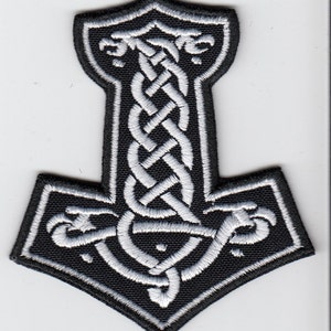 May include: Black embroidered patch featuring a white Mjolnir, the Norse god Thor's hammer, with a Celtic knot design.