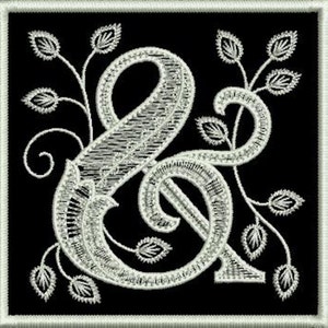 Pode incluir: Um símbolo de ampersand branco bordado com desenhos florais sobre um fundo preto.