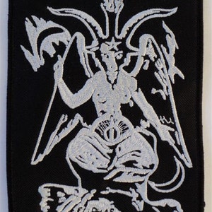 May include: White embroidered patch on a black background depicting a three-headed demon with a single eye in the center of its chest. The demon is sitting on a rock with the text "Leviathan" below it.