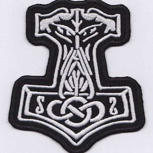 May include: A black and white embroidered patch featuring a stylised hammer with a knot design and the letters "SCO2" in the centre.