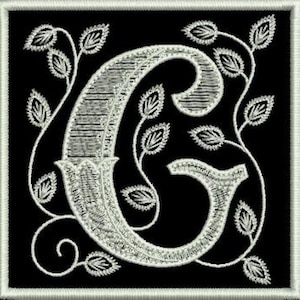 May include: A white embroidered letter 'C' with a vine and leaf design on a black background.