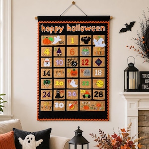 May include: A black fabric wall hanging calendar with orange scalloped trim and the text happy halloween at the top. It features thirty-one tan square pockets, each decorated with colorful felt Halloween icons like ghosts, pumpkins, and bats.