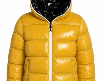 May include: A mustard yellow puffer jacket with a glossy finish, featuring horizontal quilted channels, a hood with a shiny black interior lining, and a central white zip closure that extends from the hem to the top of the collar.