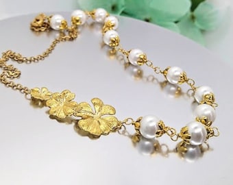 Gouden plumeria-bloemketting: parel bruidssieraden