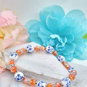 Pulsera de flores de porcelana azul: joyería floral de cristal naranja