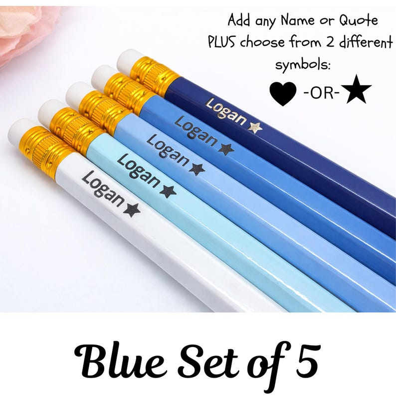 May include: A set of five blue pencils, each with a different shade of blue. Each pencil is personalized with the name "Logan" and a star symbol. The pencils have gold-colored metal bands and white erasers. Text on the image reads "Add any Name or Quote PLUS choose from 2 different symbols: -OR-" and "Blue Set of 5".