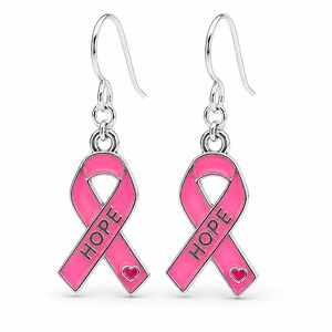 May include: A pair of silver-toned drop earrings featuring a pink enamel awareness ribbon design. Each ribbon is embossed with the word HOPE in black capital letters and includes a small pink heart detail at the bottom, suspended from silver hooks.