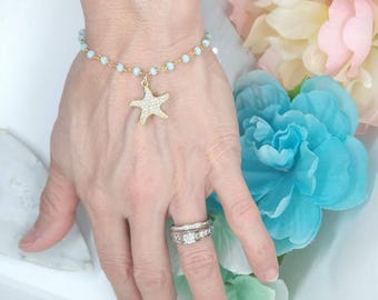 Bracciale con ciondolo a stella marina in oro: pietre preziose con perline, gioielli da spiaggia