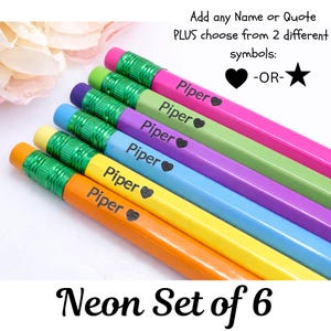 May include: A set of six neon-colored pencils, each with a different color, including pink, green, purple, blue, yellow, and orange. Each pencil is personalized with the name "Piper" and a heart symbol. The text "Neon Set of 6" is at the bottom.