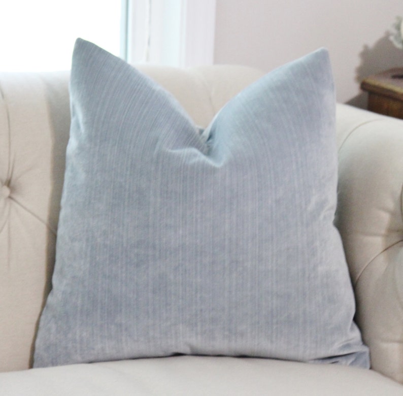 silver and blue pillows