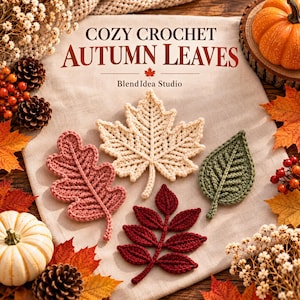 May include: Four crocheted leaves in cream, dusty pink, dark red, and olive green arranged on a beige fabric background. The text COZY CROCHET AUTUMN LEAVES and Blend Idea Studio is printed above the leaves. Decorative pumpkins and pinecones surround the fabric.