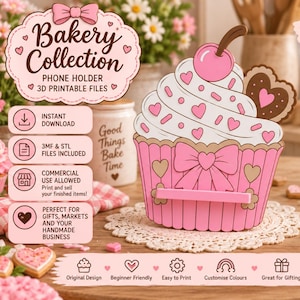 Puede incluir: Un soporte para teléfono con forma de cupcake imprimible en 3D, con envoltorio rosa y corazones, glaseado blanco, una cereza y una galleta en forma de corazón. Incluye una repisa frontal para el teléfono y un soporte trasero para estabilidad.