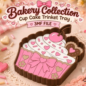 Puede incluir: Una bandeja para baratijas marrón con forma de cupcake que presenta un diseño de glaseado rosa con corazones, una cereza y un lazo. El texto Bakery Collection Cup Cake Trinket Tray, 3MF FILE aparece arriba y Artistry BY ANNA abajo.