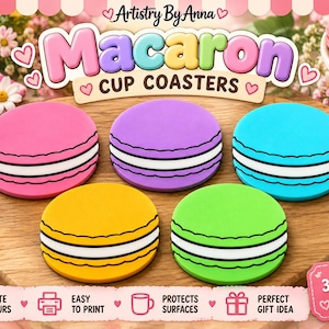 Pode incluir: Um conjunto de cinco porta-copos circulares em forma de macaron nas cores rosa, roxo, azul, amarelo e verde. Cada porta-copos apresenta uma camada central branca com contornos pretos. O texto Artistry By Anna Macaron CUP COASTERS e 3MF FILES ONLY é visível.