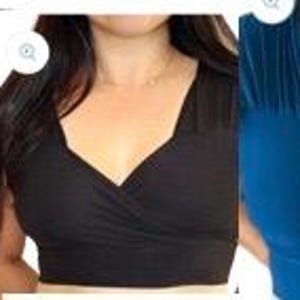 May include: Three women's tops in different colors: a dark blue top, a black top, and a teal top. All three tops have a deep V-neckline and a wrap-style design.