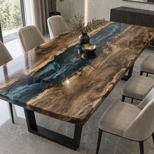 May include: A rectangular dining table featuring a natural wood slab with a prominent blue resin river inlay running through the centre, supported by black metal legs, surrounded by eight light grey upholstered dining chairs.